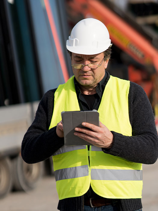Construction worker looking at table